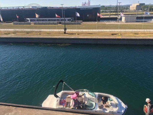 Visit Michigans Upper Peninsula with Kids - Soo Locks - Opposites - American Integrity and a Small Boat