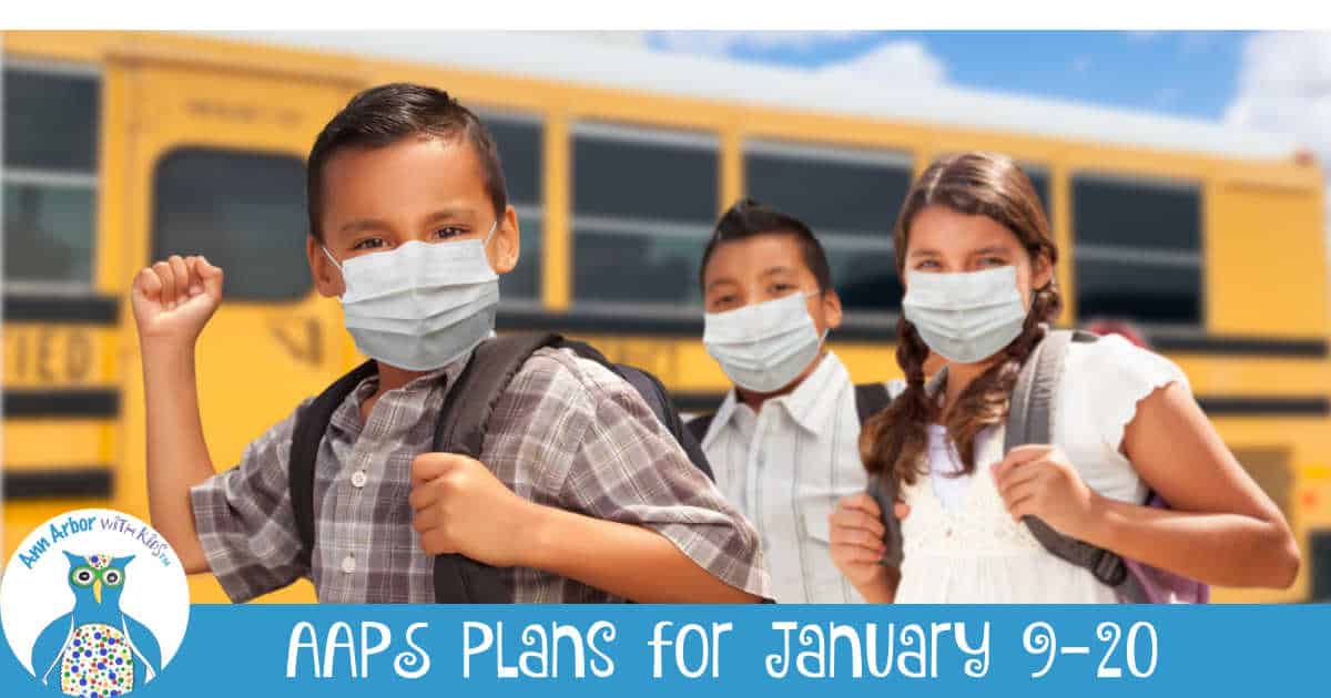 Ann Arbor Public Schools Plans for January 9-20 - Students wearing masks in front of a bus.
