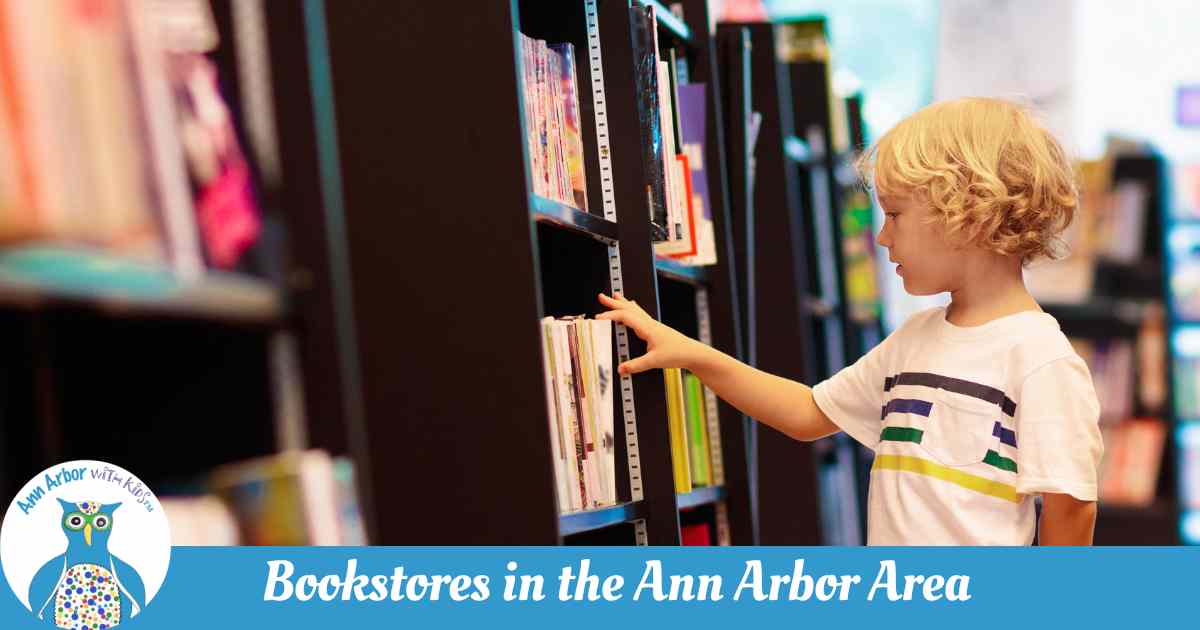 Bookstores in the Ann Arbor Area - a boy looks at books on dark bookcases