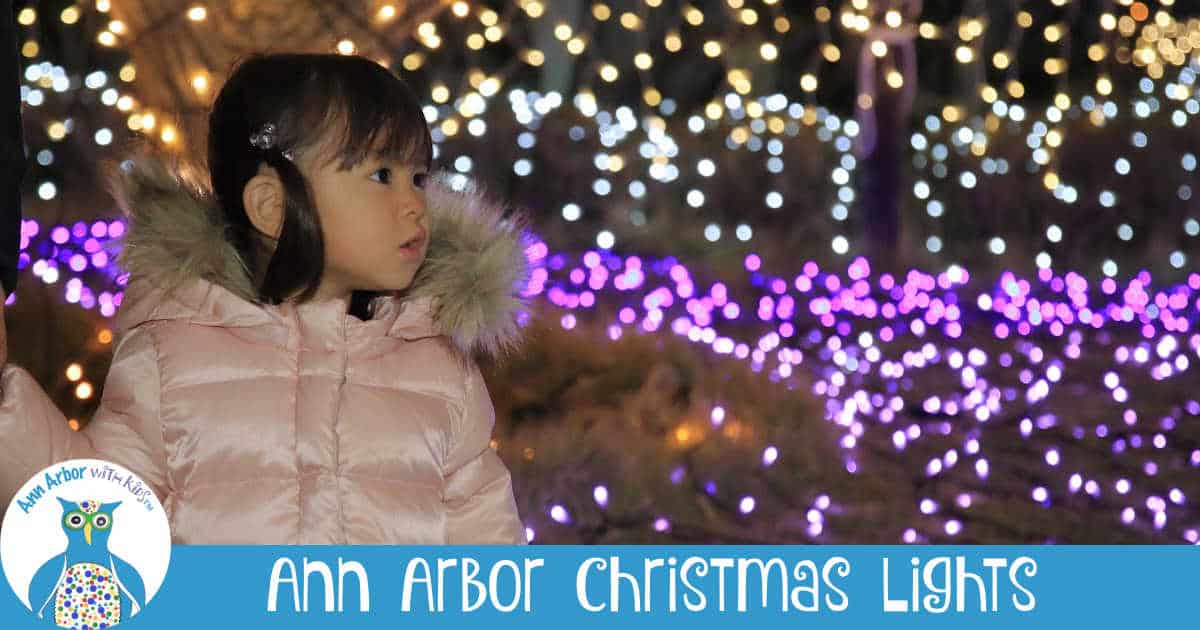 Ann Arbor Christmas Lights - Girl looking at purple and white lights.