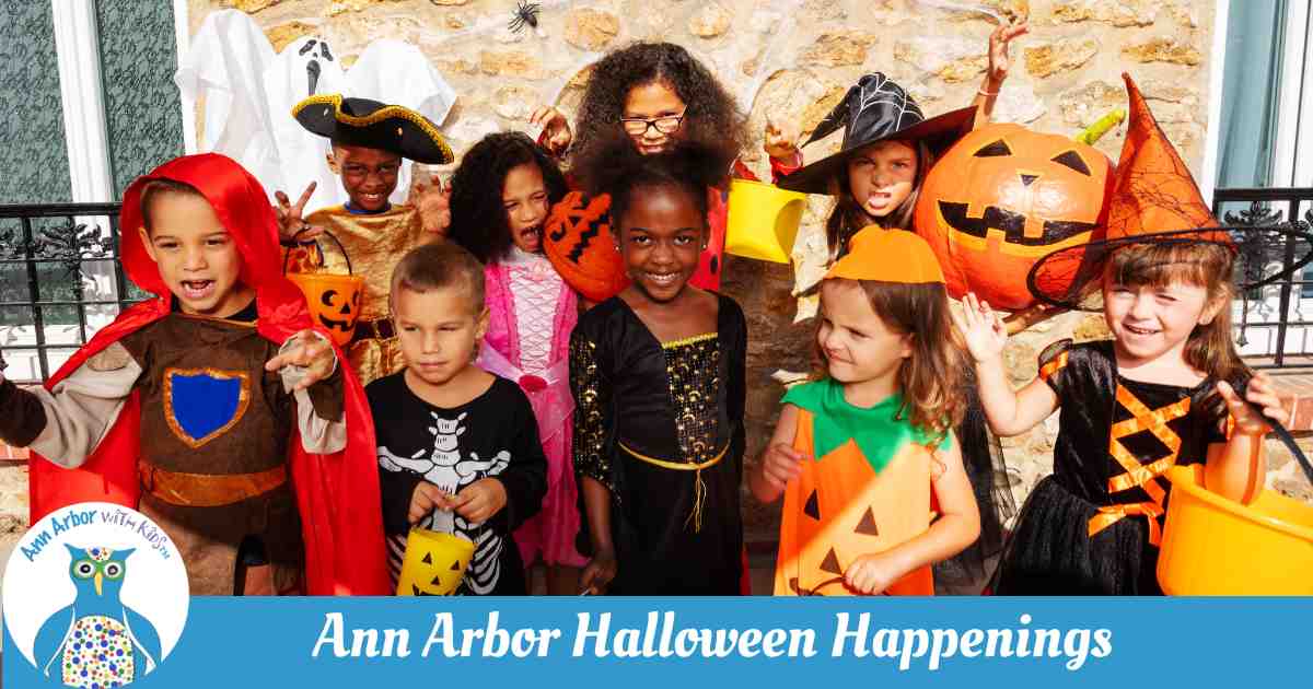 Ann Arbor Halloween Happenings - Kids dressed for Halloween in forn tof a house and windows