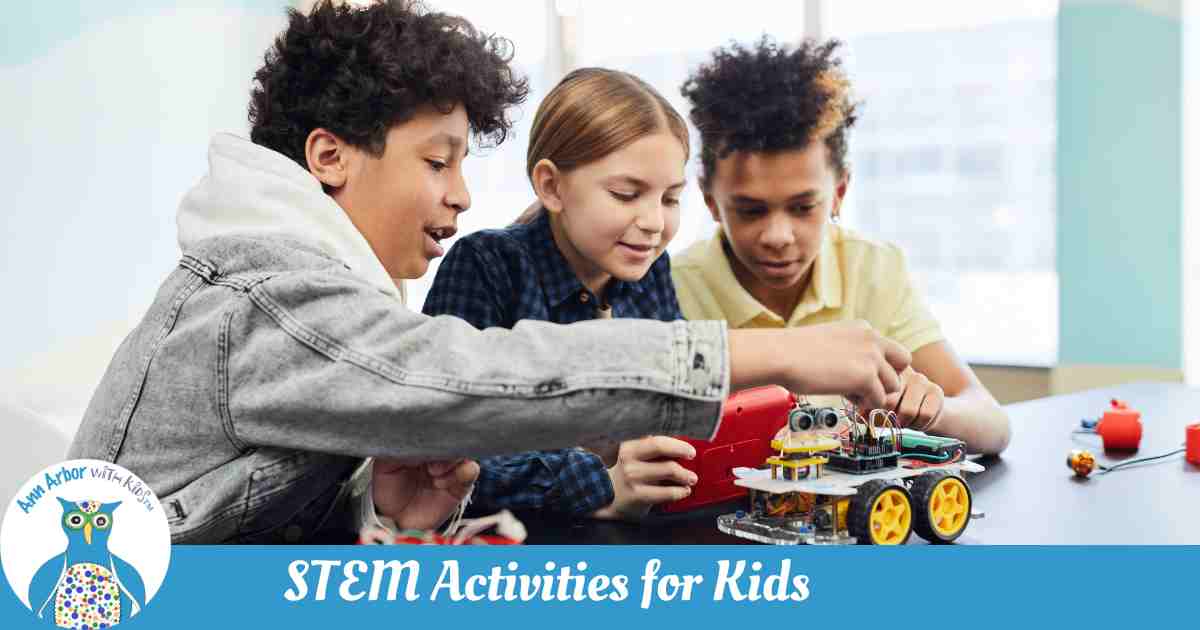 Ann Arbor STEM Activities for Kids - 3 tweens working with wiring a robot they are programming