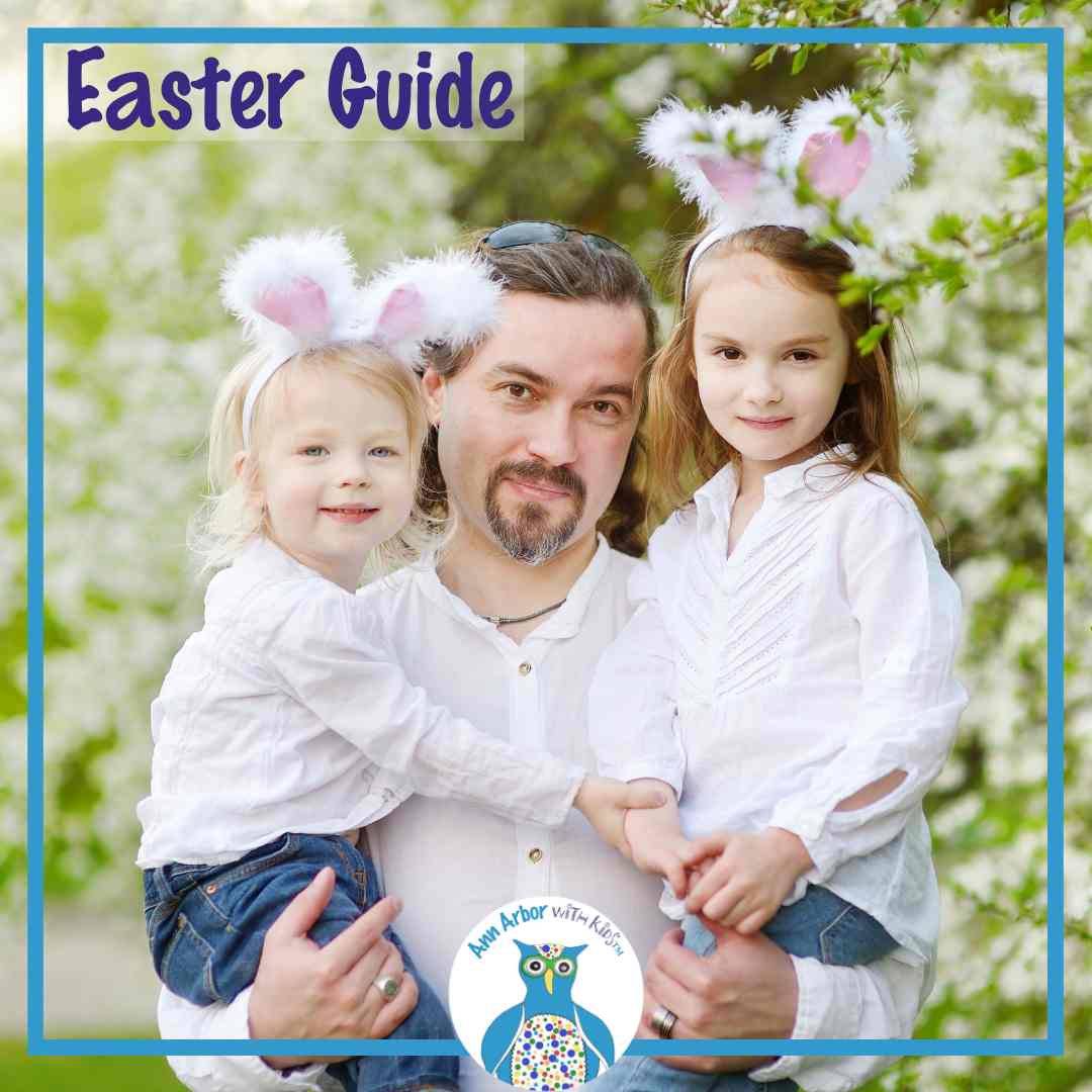 Easter Guide - Father in a white shirt & jeans holds 2 girls in jeans, white shirts, and bunny ears.
