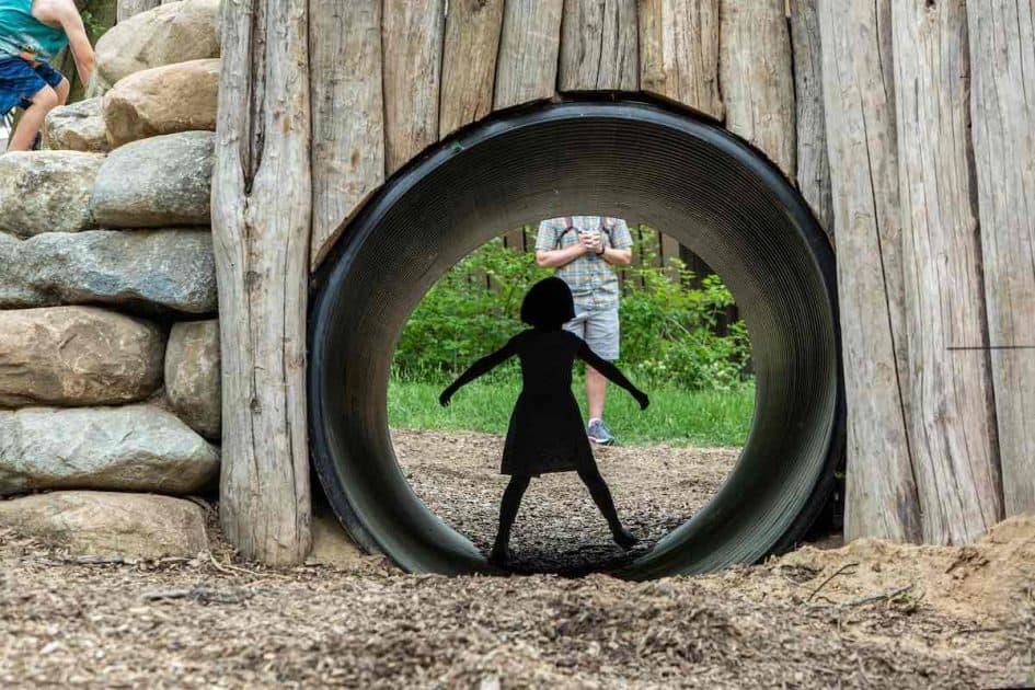Leslie Science & Nature Center - Nature Playscape Girl in walkthrough tunnel