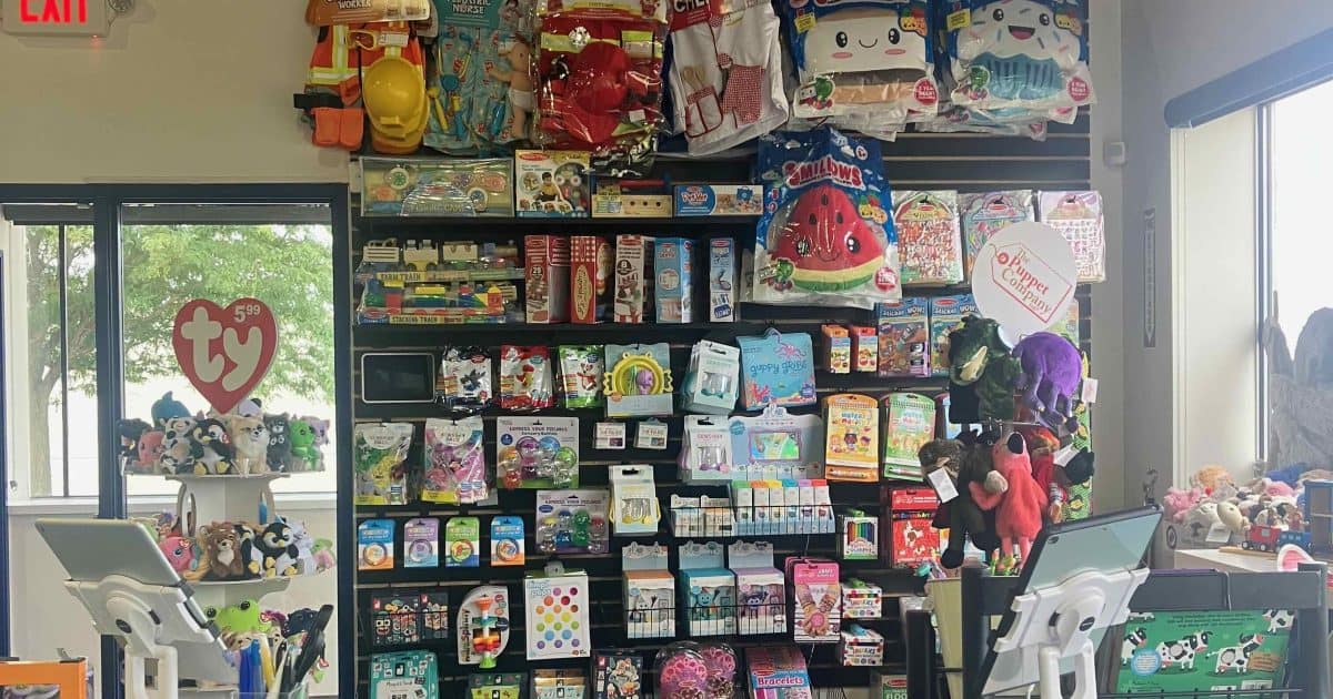 We Rock the Spectrum Retail Shop in lobby - Ty stuffed animal display and various toys hanging on a display wall.